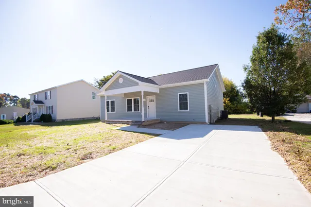 a view of house with yard and pathway
