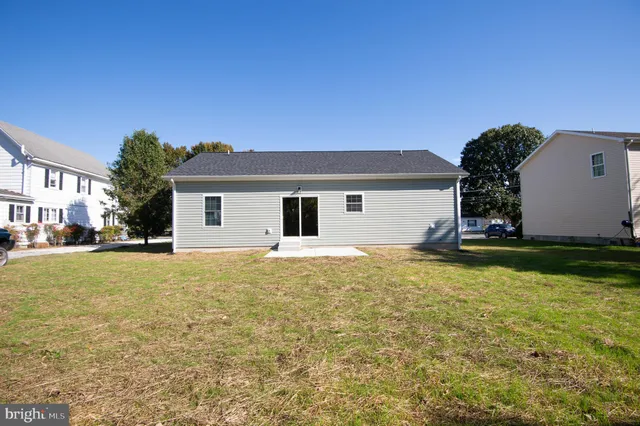 a house view with swimming pool in front of it