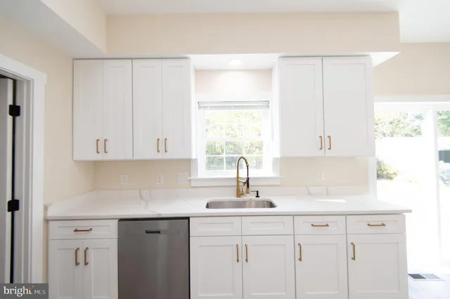 a kitchen with a refrigerator stove and microwave