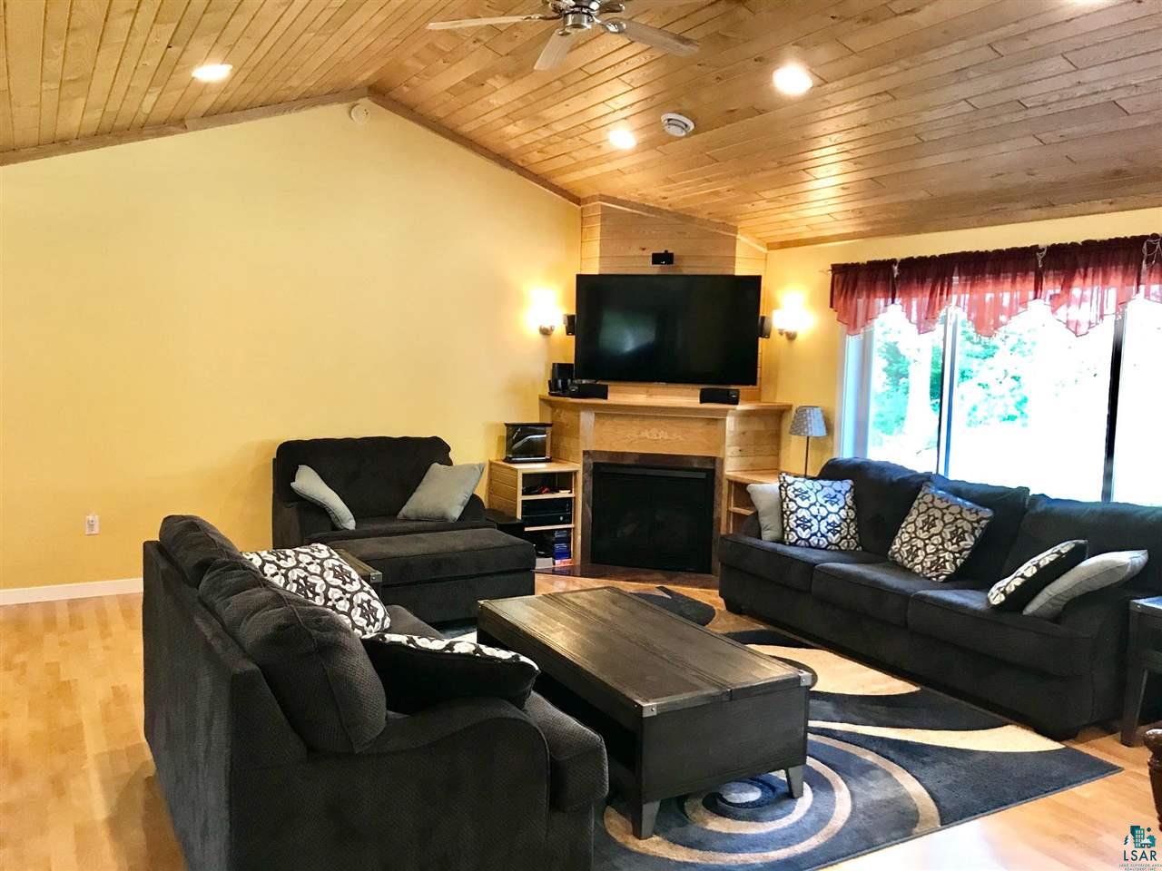 5048 Independence Road Saginaw, MN 55779 - Photo 13 of 34 LIVING ROOM FIREPLACE VAULTED T & G CEILINGS