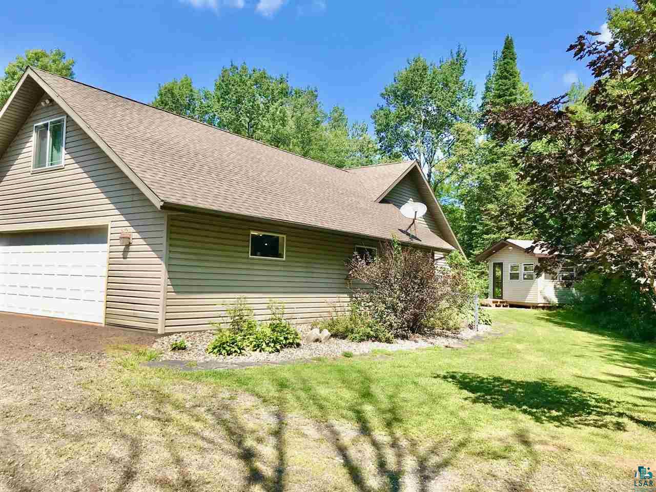 5048 Independence Road Saginaw, MN 55779 - Photo 32 of 34 SOUTH SIDE HOME LANDSCAPING & SLATE STONE SIDEWALK