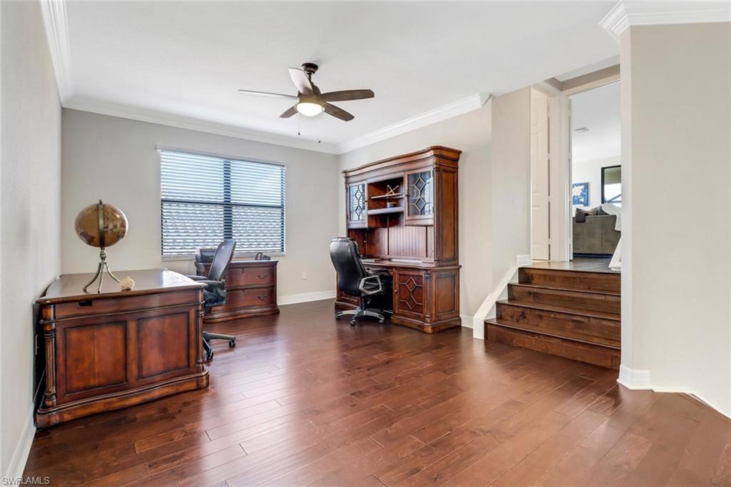 3260 Atlantic Circle Naples, FL 34119 - Photo 22 of 50 a living room with furniture and wooden floor