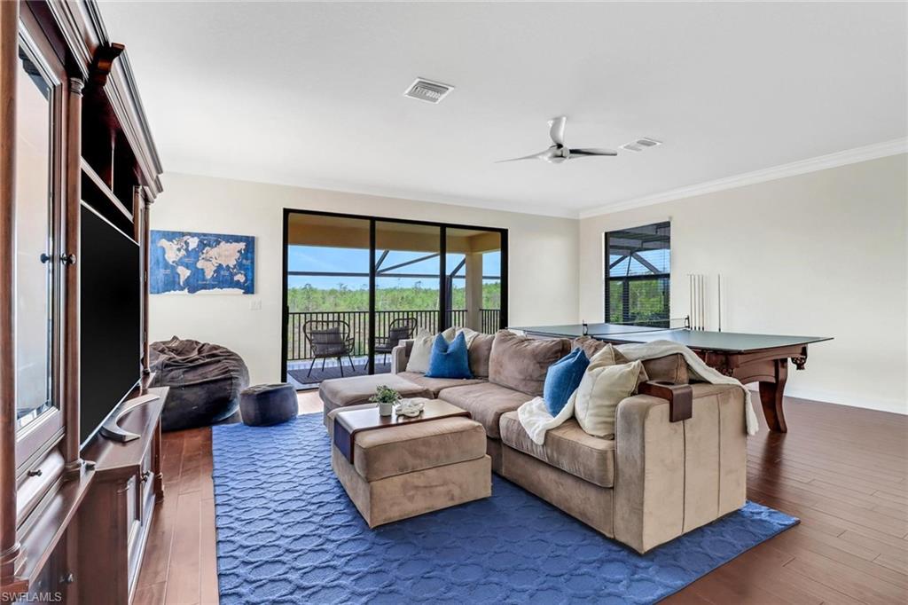 3260 Atlantic Circle Naples, FL 34119 - Photo 24 of 50 a living room with furniture and a large window
