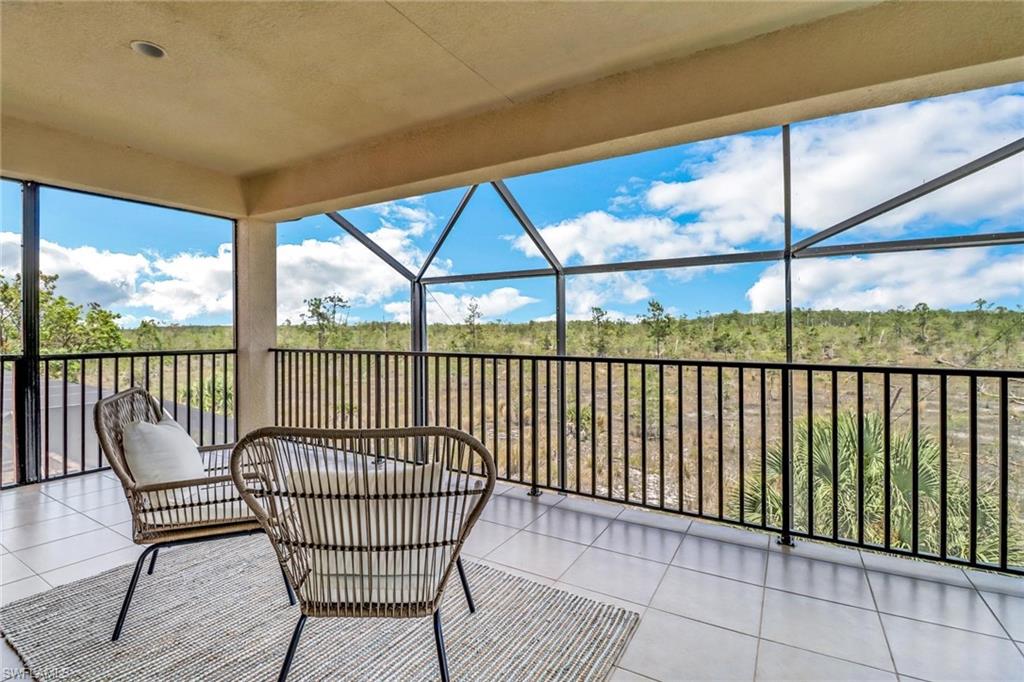 3260 Atlantic Circle Naples, FL 34119 - Photo 25 of 50 a view of a city from a balcony