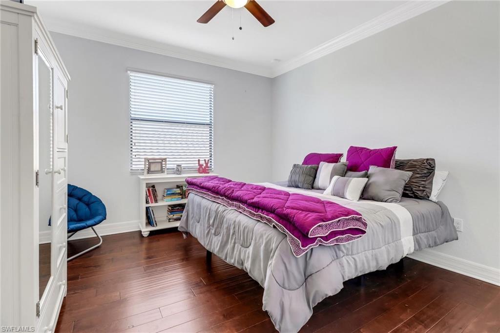 3260 Atlantic Circle Naples, FL 34119 - Photo 26 of 50 a bedroom with a bed and a window