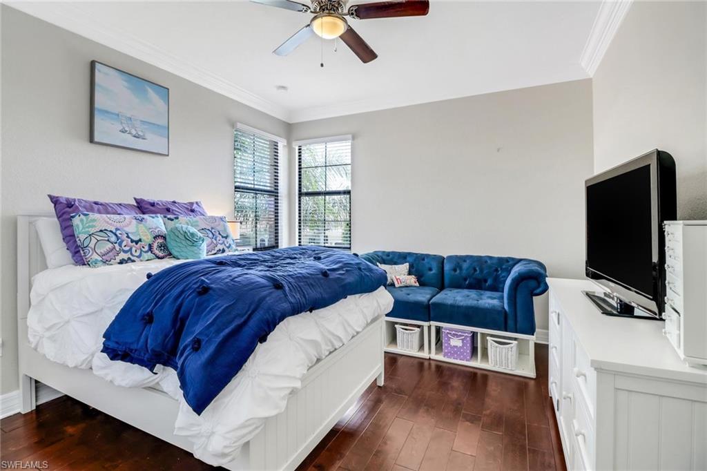 3260 Atlantic Circle Naples, FL 34119 - Photo 29 of 50 a bedroom with a bed and a flat screen tv