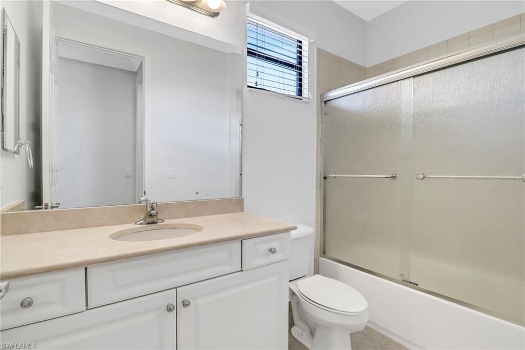 3260 Atlantic Circle Naples, FL 34119 - Photo 32 of 50 a bathroom with a sink a toilet and shower