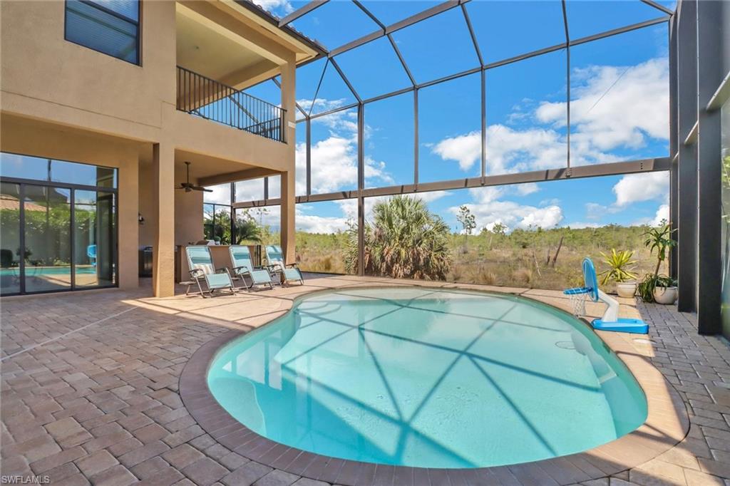 3260 Atlantic Circle Naples, FL 34119 - Photo 35 of 50 a view of a living room and window