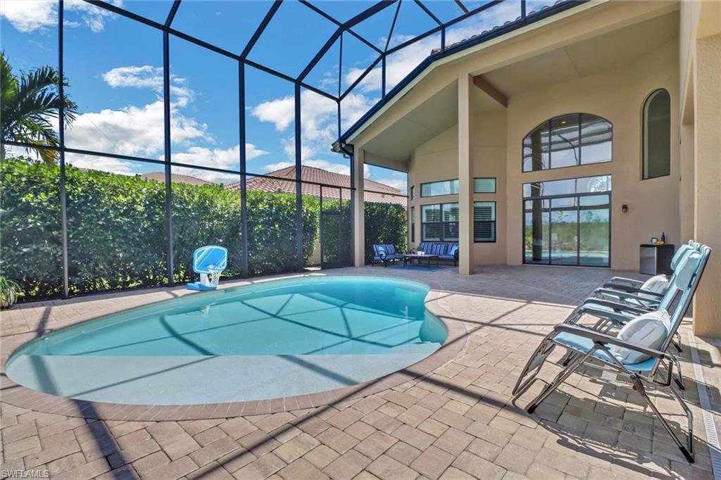 3260 Atlantic Circle Naples, FL 34119 - Photo 37 of 50 a view of a chairs and tables in the patio