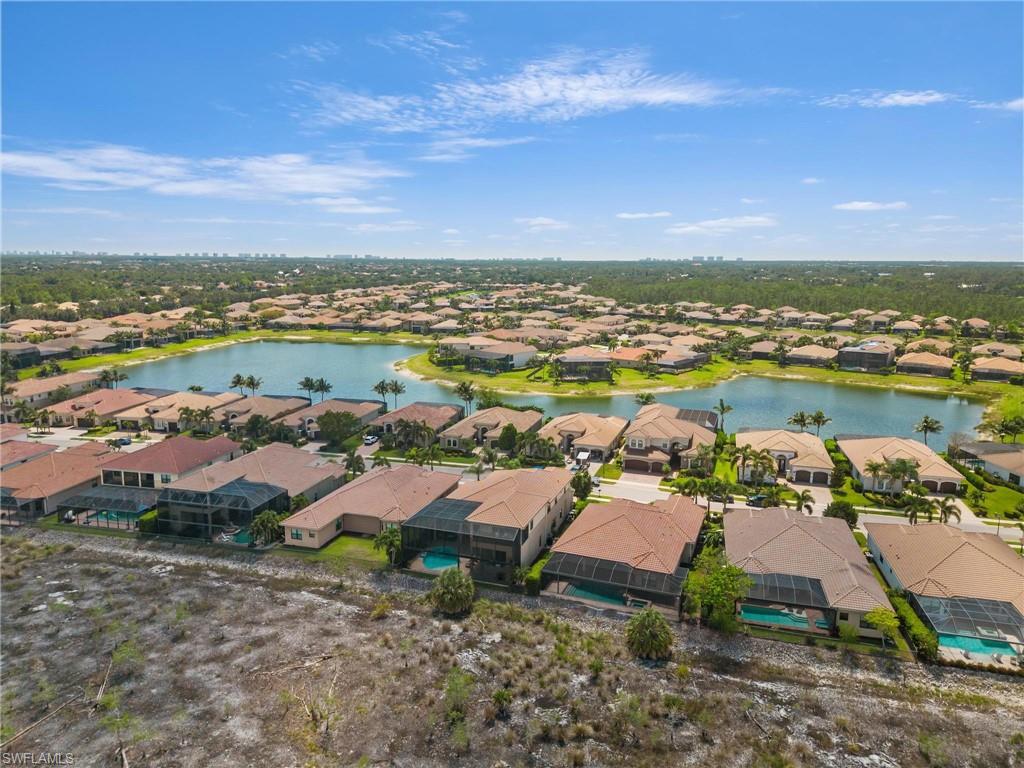 3260 Atlantic Circle Naples, FL 34119 - Photo 38 of 50 an aerial view of residential houses with outdoor space