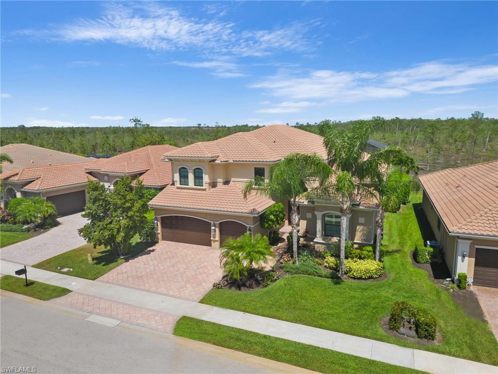 3260 Atlantic Circle Naples, FL 34119 - Photo 40 of 50 an aerial view of a house with a garden