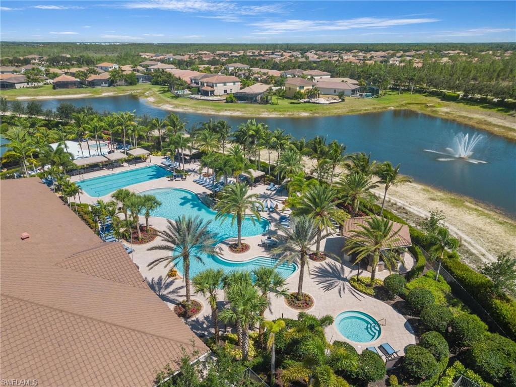 3260 Atlantic Circle Naples, FL 34119 - Photo 41 of 50 an aerial view of residential houses with outdoor space and lake view