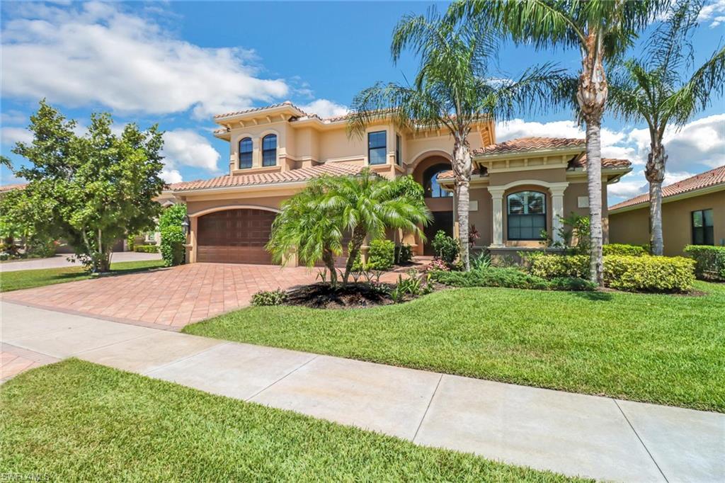 3260 Atlantic Circle Naples, FL 34119 - Photo 50 of 50 a view of house with a garden