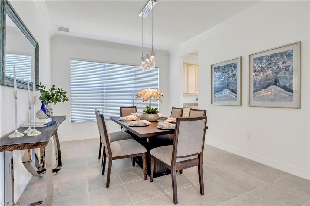 3260 Atlantic Circle Naples, FL 34119 - Photo 10 of 50 a dining room with furniture and window