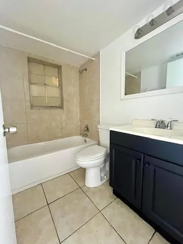 a bathroom with a sink a toilet and bathtub