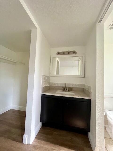 3440 Rudolph Road, Unit 4 Lake Worth, FL 33461 - Photo 8 of 9 a bathroom with a sink and a mirror