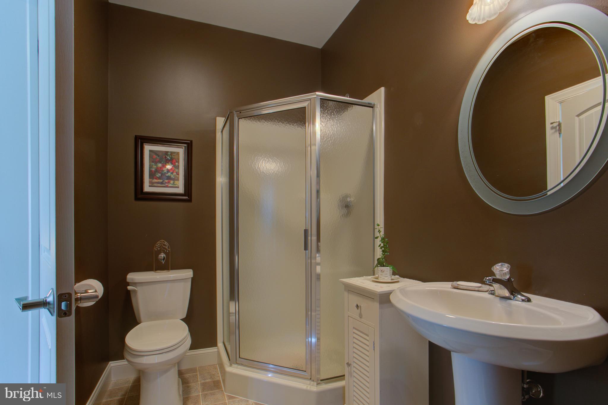 131 Baneberry Lane Lititz, PA 17543 - Photo 13 of 26 a bathroom with a toilet sink and mirror