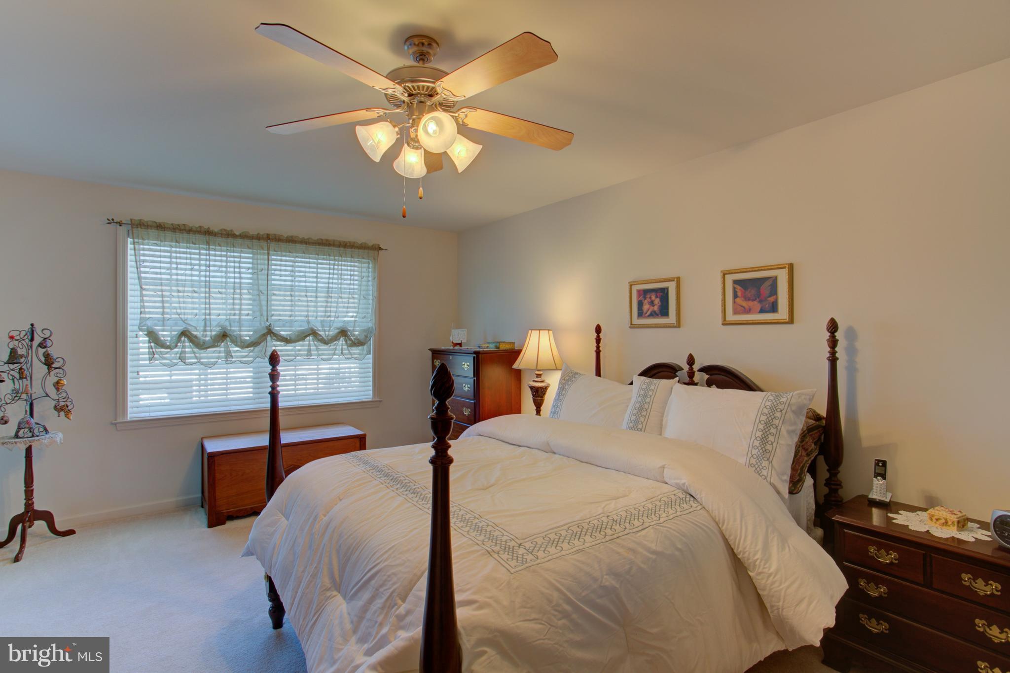 131 Baneberry Lane Lititz, PA 17543 - Photo 16 of 26 a bedroom with a bed and a table