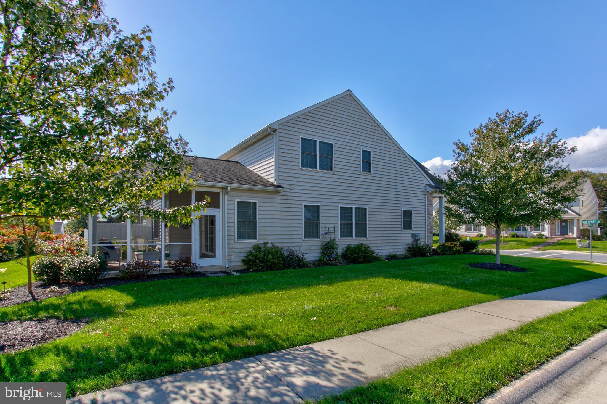 131 Baneberry Lane Lititz, PA 17543 - Photo 5 of 26 a front view of a house with a garden and trees