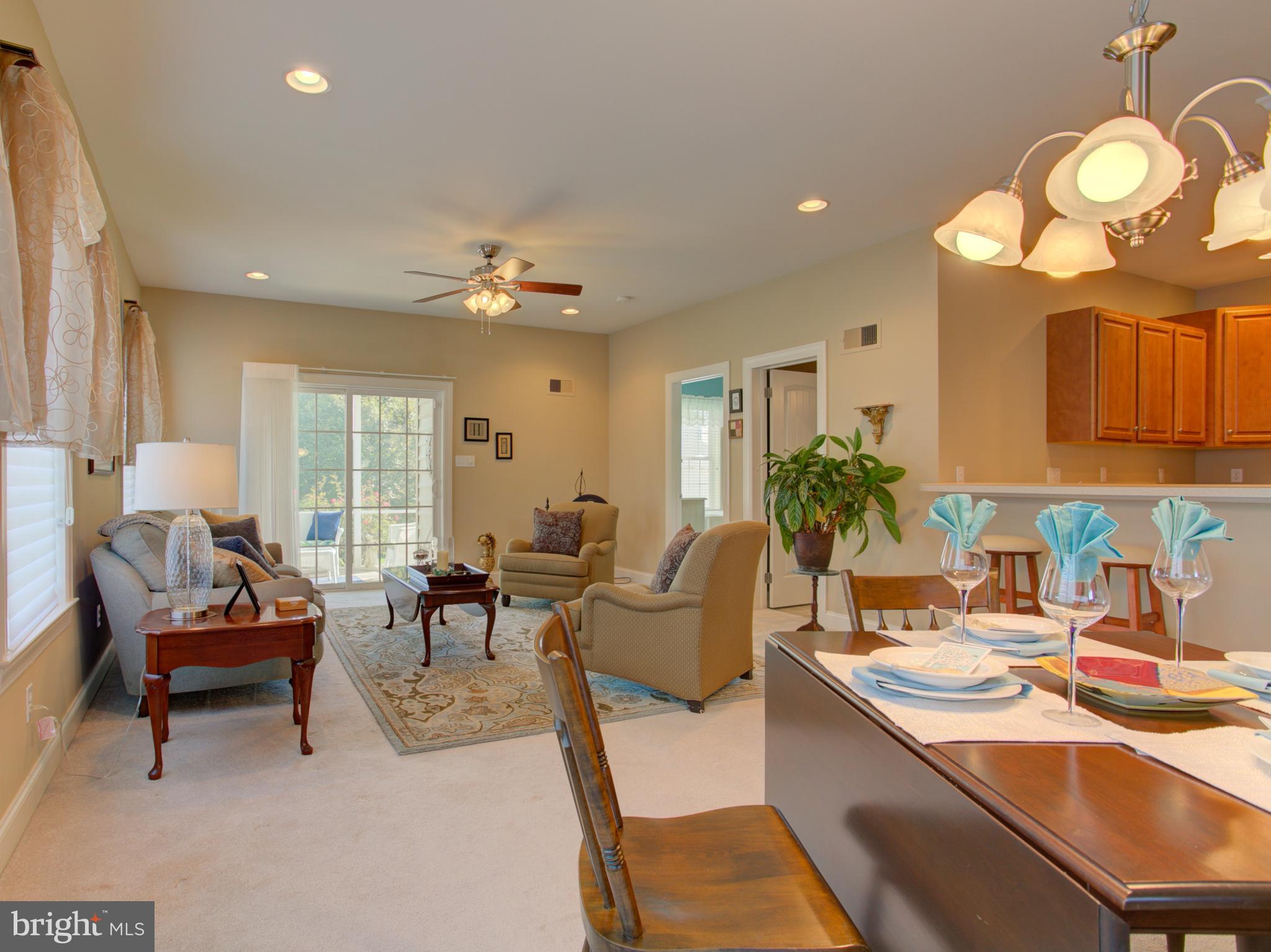 131 Baneberry Lane Lititz, PA 17543 - Photo 8 of 26 a living room with furniture a chandelier and a dining table