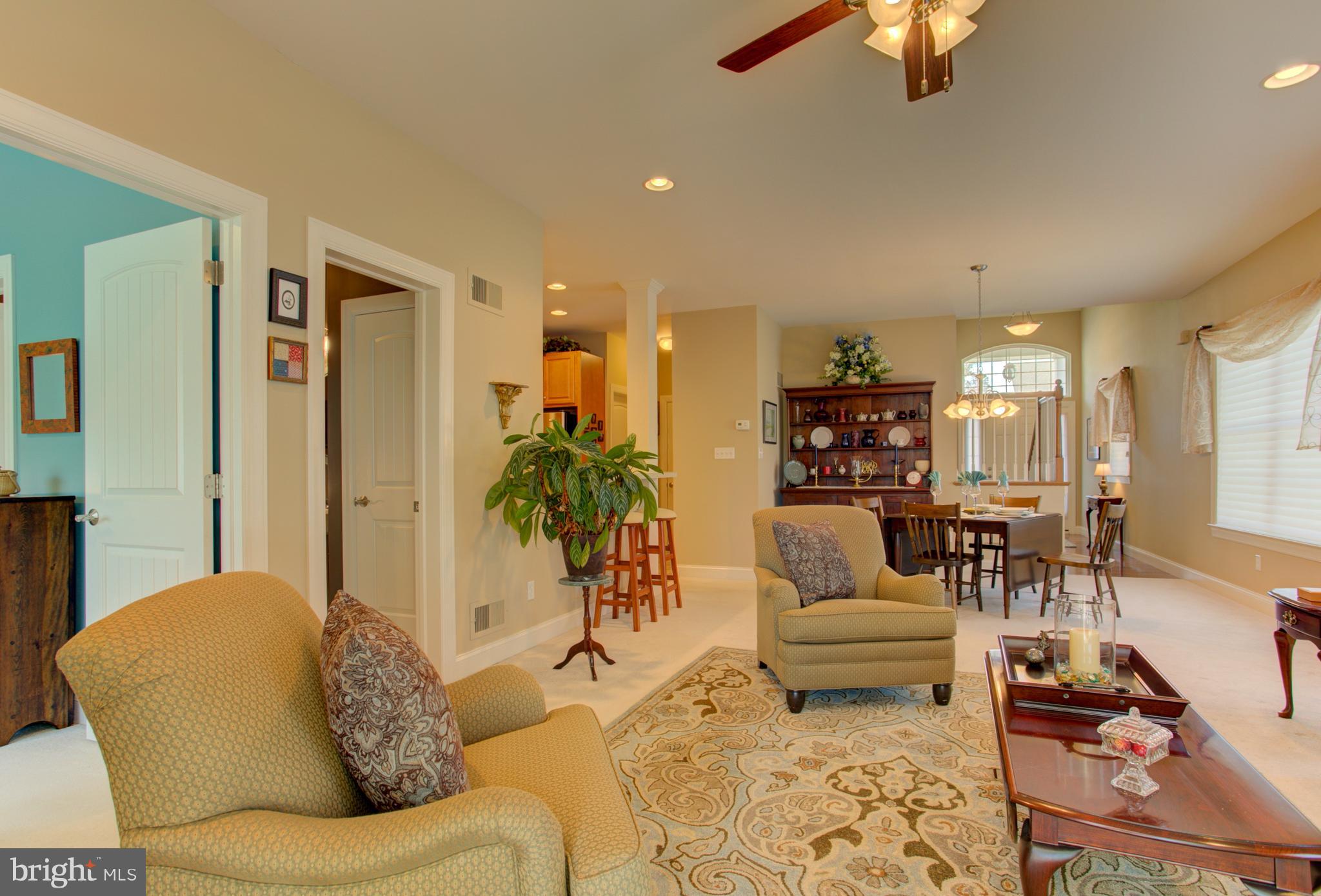 131 Baneberry Lane Lititz, PA 17543 - Photo 9 of 26 a living room with furniture and a dining table with kitchen view