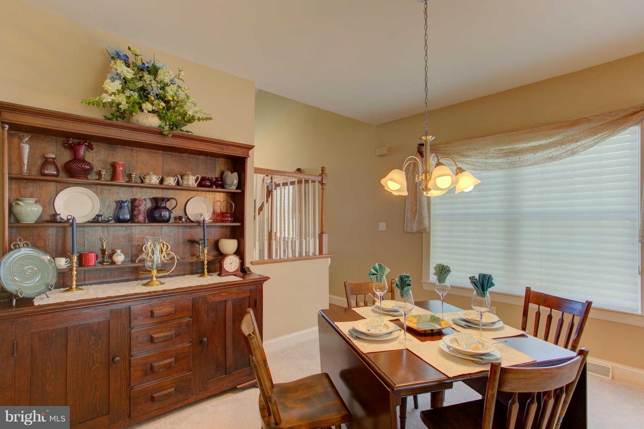 131 Baneberry Lane Lititz, PA 17543 - Photo 10 of 26 a kitchen with a table and chairs in it