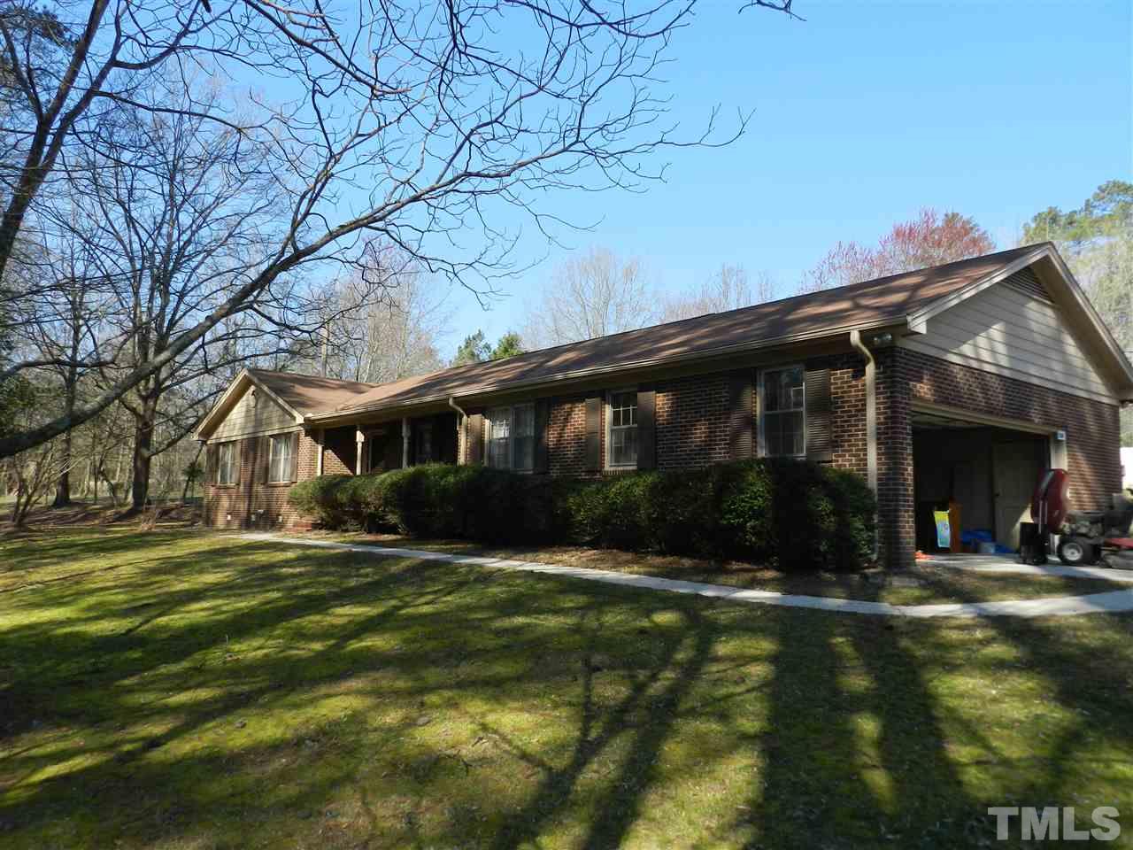 7209 Battle Bridge Road Raleigh, NC 27610 - Photo 1 of 21 a front view of a house with a yard