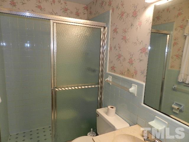 7209 Battle Bridge Road Raleigh, NC 27610 - Photo 16 of 21 a bathroom with a shower and toilet