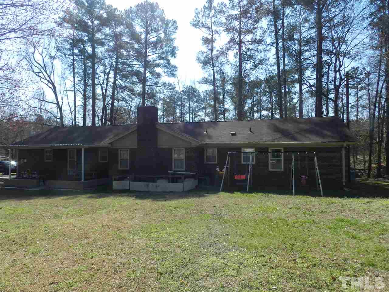 7209 Battle Bridge Road Raleigh, NC 27610 - Photo 17 of 21 front view of a house with a yard