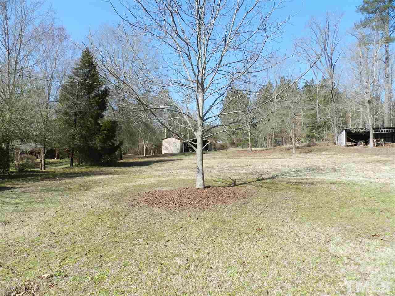 7209 Battle Bridge Road Raleigh, NC 27610 - Photo 18 of 21 a view of a yard with a house