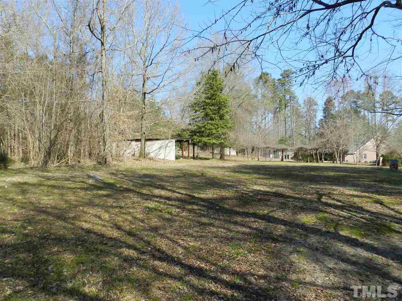 7209 Battle Bridge Road Raleigh, NC 27610 - Photo 19 of 21 a view of dirt field with large trees