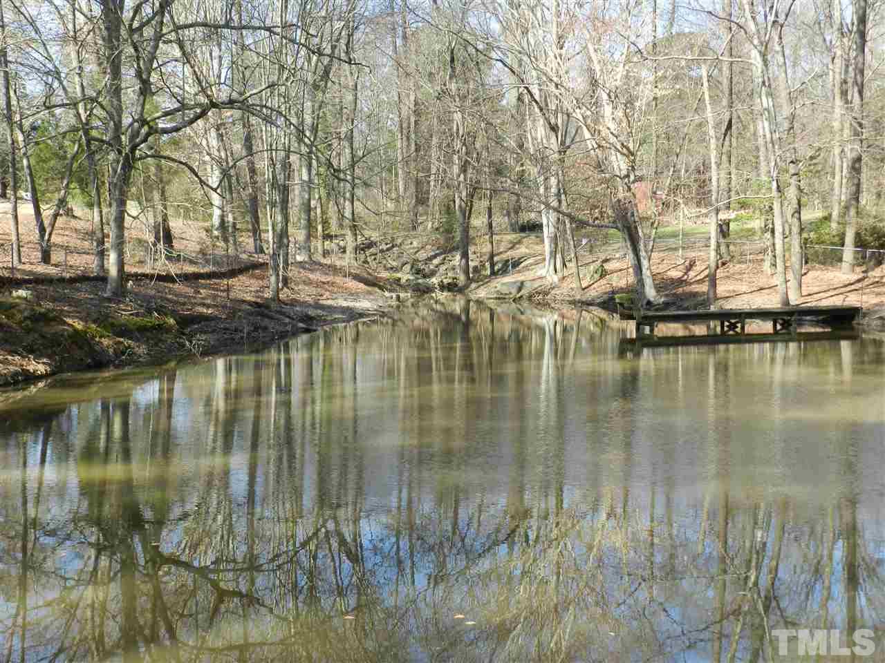 7209 Battle Bridge Road Raleigh, NC 27610 - Photo 20 of 21 a lake view with large trees