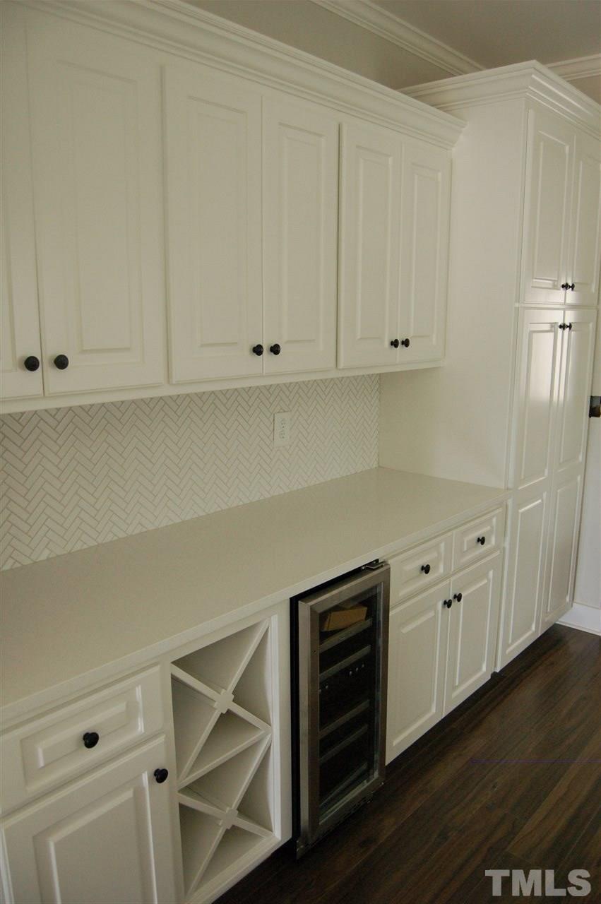 1433 Garner Road Raleigh, NC 27610 - Photo 15 of 23 a view of cabinets and wooden floor