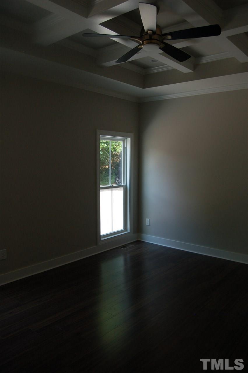 1433 Garner Road Raleigh, NC 27610 - Photo 17 of 23 a view of an empty room with wooden floor and a window
