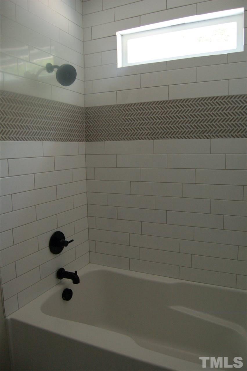 1433 Garner Road Raleigh, NC 27610 - Photo 20 of 23 a bathroom with a bathtub