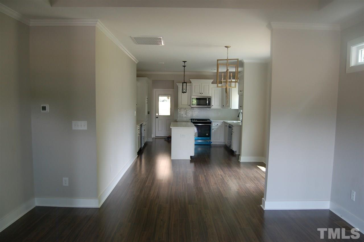 1433 Garner Road Raleigh, NC 27610 - Photo 22 of 23 a view of a kitchen with wooden floor and a window