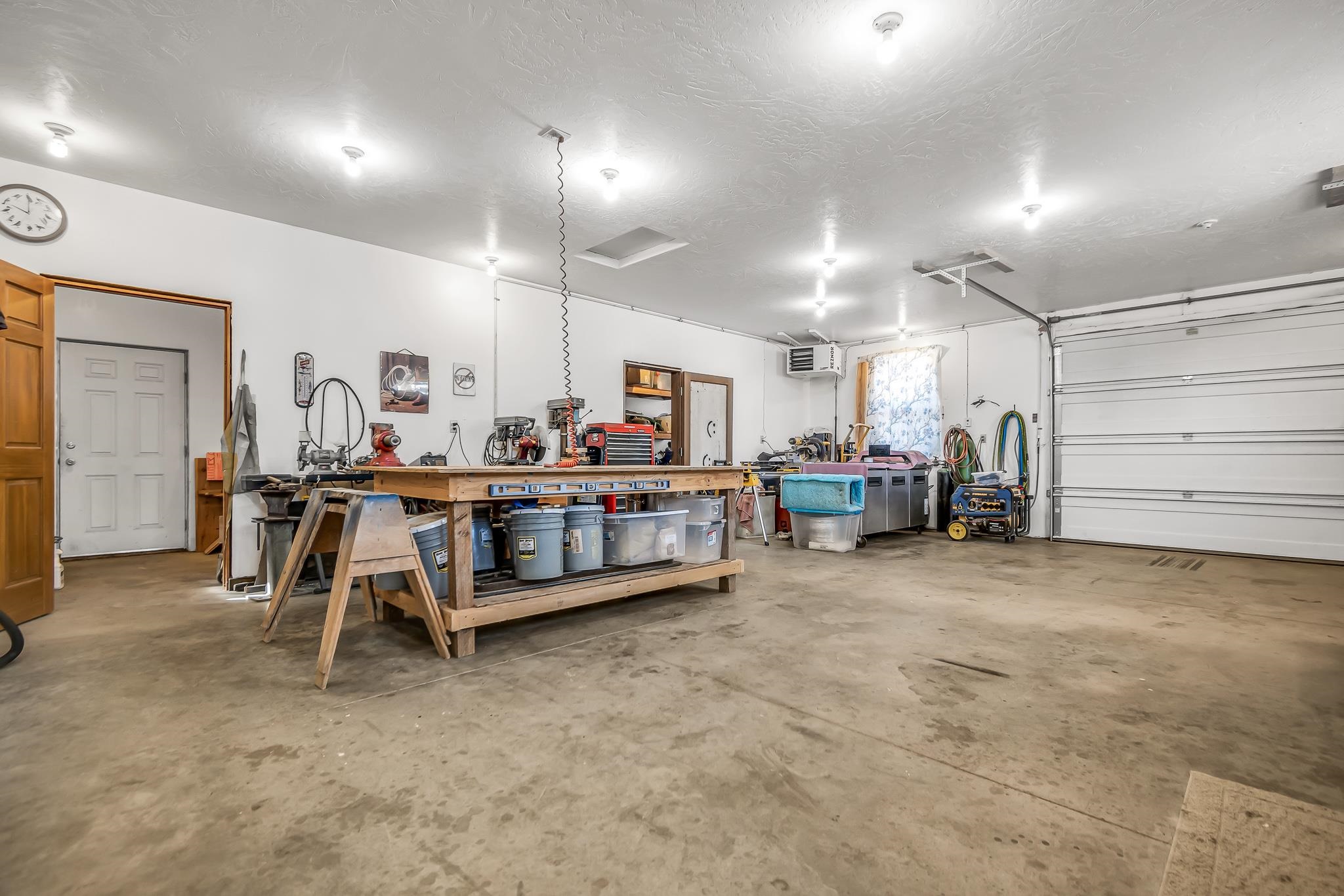962-17 17 1/4 Road Fruita, CO 81521 - Photo 24 of 37 a room with lots of furniture and a chandelier
