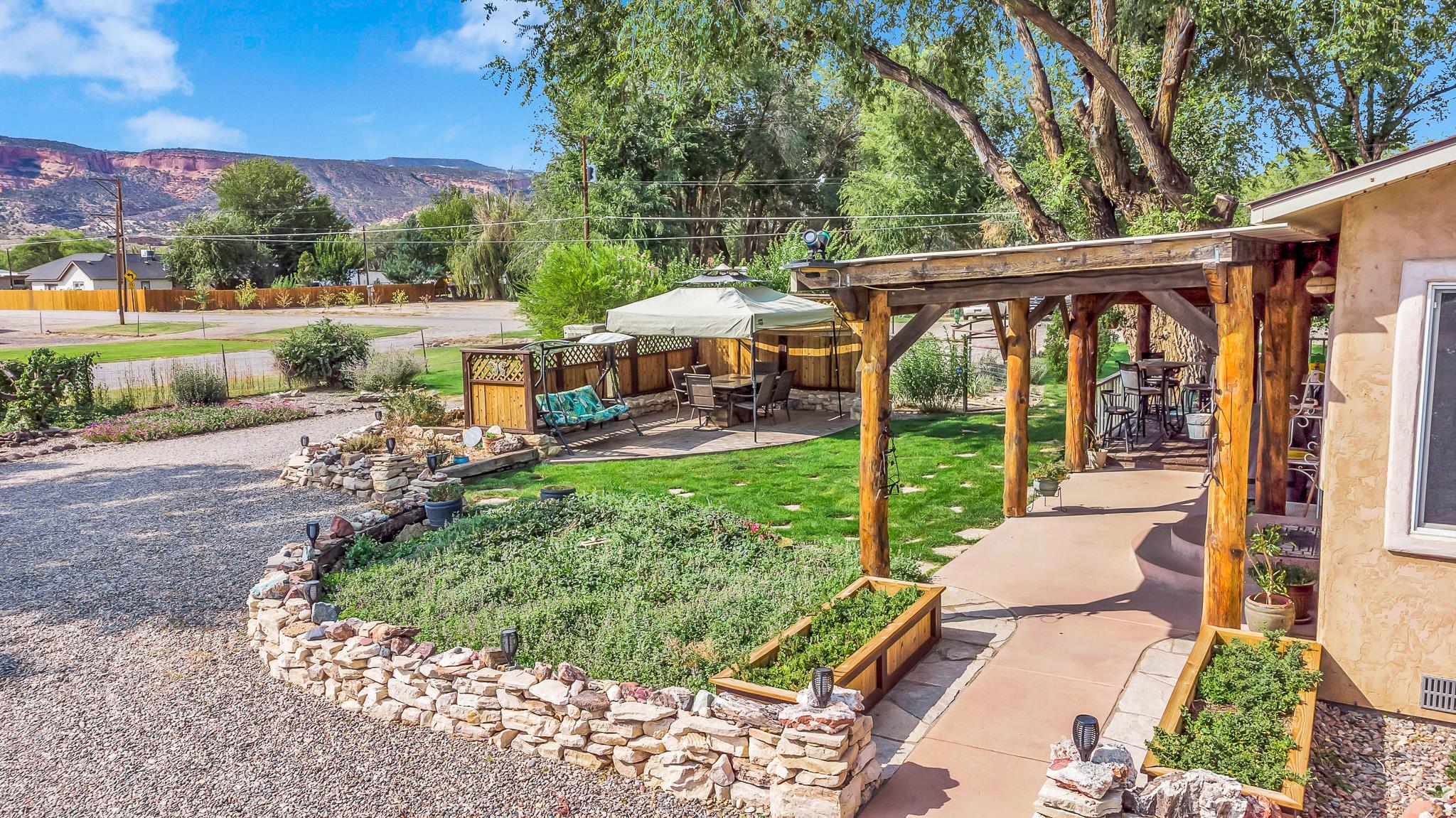 962-17 17 1/4 Road Fruita, CO 81521 - Photo 26 of 37 a view of a patio with chairs and a yard