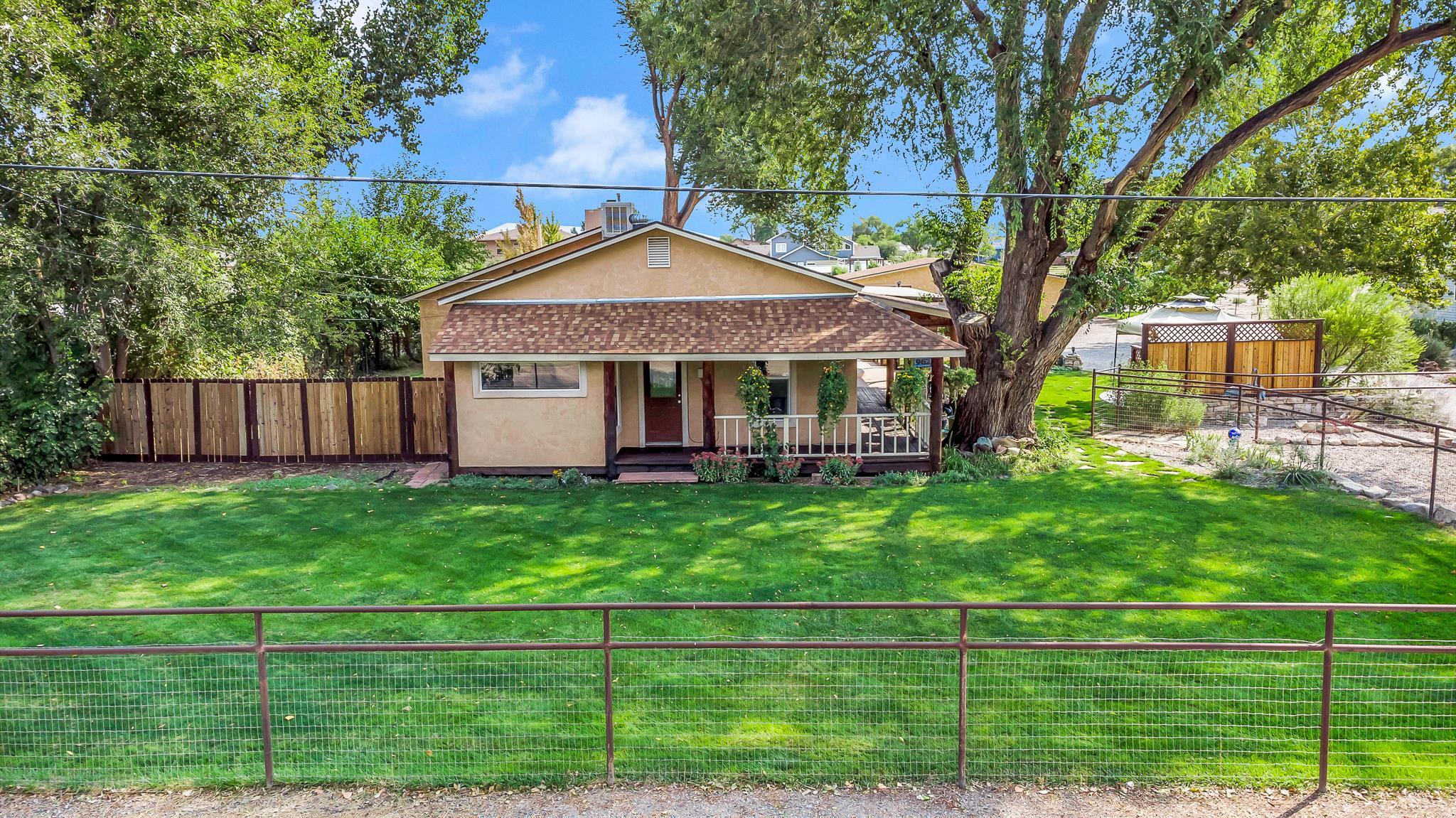 962-17 17 1/4 Road Fruita, CO 81521 - Photo 27 of 37 a front view of a house with a yard