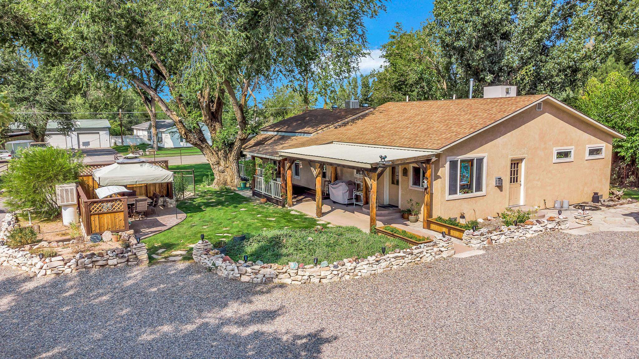 962-17 17 1/4 Road Fruita, CO 81521 - Photo 3 of 37 a view of a house with a chairs and table in a patio