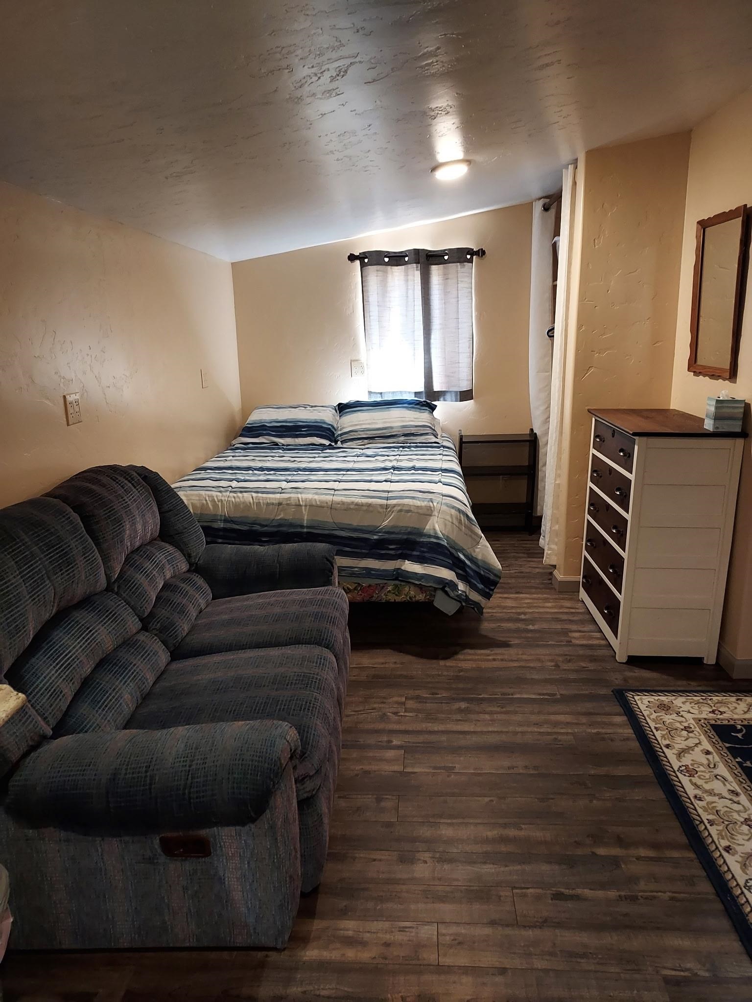 962-17 17 1/4 Road Fruita, CO 81521 - Photo 35 of 37 a living room with furniture and a fireplace
