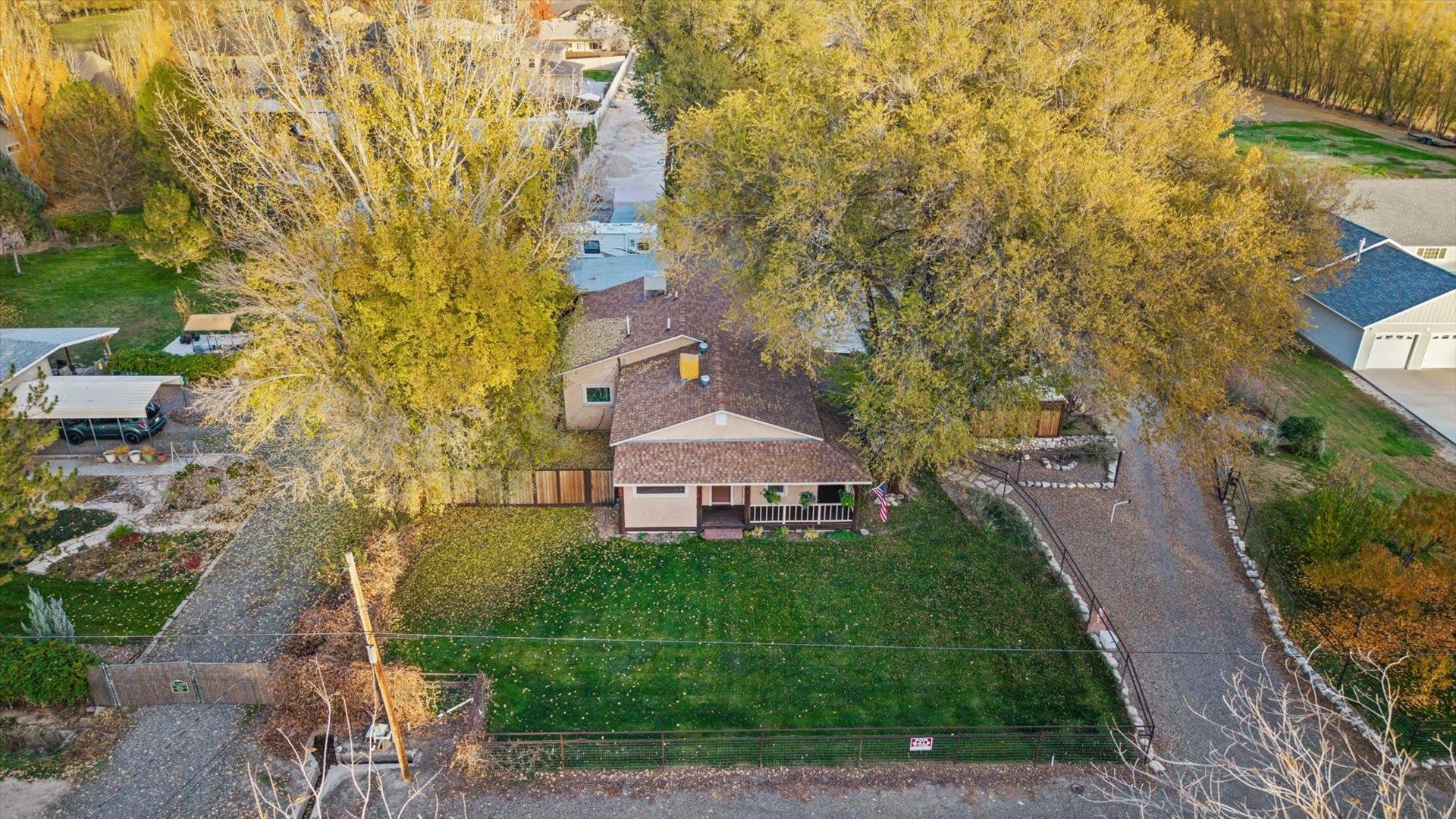 962-17 17 1/4 Road Fruita, CO 81521 - Photo 4 of 37 a front view of a house with garden