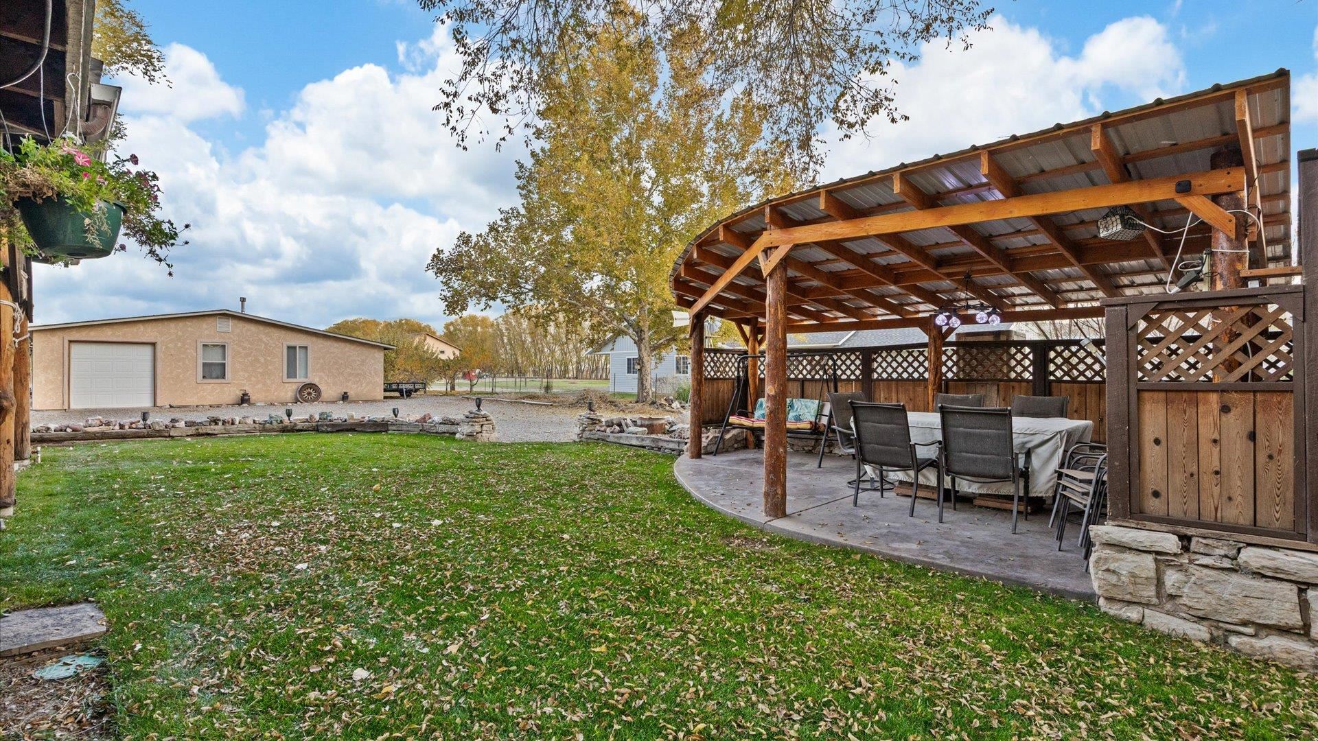 962-17 17 1/4 Road Fruita, CO 81521 - Photo 7 of 37 a view of a chair and table in the garden
