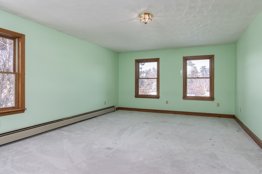 10 Ryan Road Townsend, MA 01474 - Photo 12 of 34 an empty room with windows