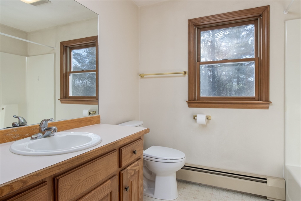 10 Ryan Road Townsend, MA 01474 - Photo 14 of 34 a bathroom with a sink a toilet and window