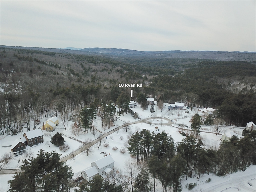 10 Ryan Road Townsend, MA 01474 - Photo 26 of 34 a view of a lake with mountains in the background