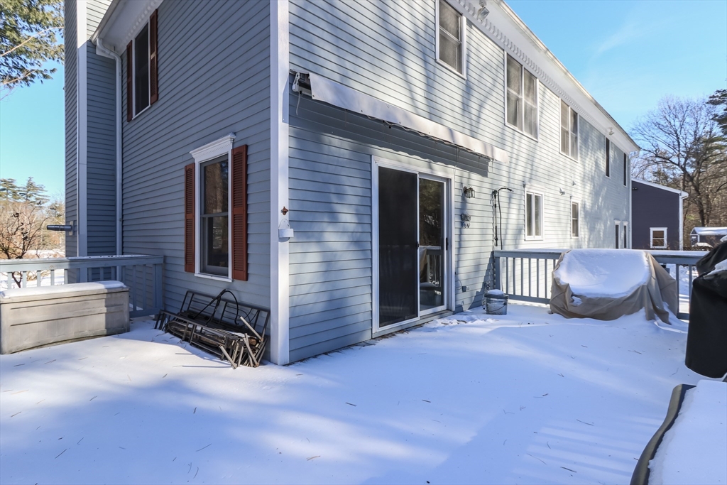 10 Ryan Road Townsend, MA 01474 - Photo 30 of 34 a view of a patio with a table and chairs and potted plants