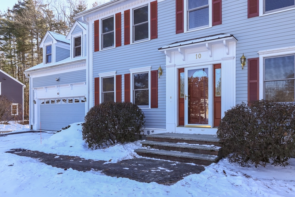 10 Ryan Road Townsend, MA 01474 - Photo 4 of 34 a view of a house with a large window and potted plants