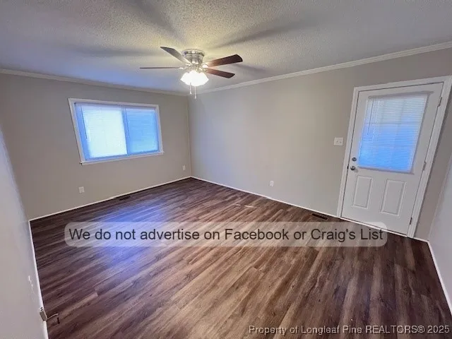 a view of a room with wooden floor and staircase