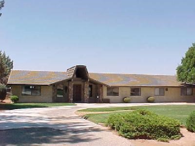 20445 Rancherias Road Apple Valley, CA 92307 - Photo 1 of 1 a front view of a house with a yard